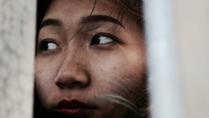 Upclose photo of a women's face.