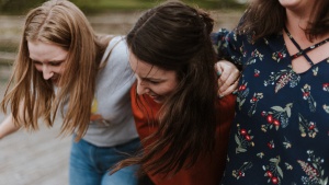 A group of young women laughing. 