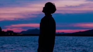 A silhouette of young man.
