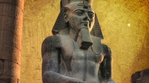 Colossus of Ramses II (made in black granite) in the Luxor Temple (Egypt)