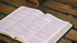 A Bible laying on a table.