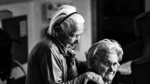 Two elderly women beside each other.