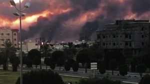 A Saudi oil facility burns after an Iranian attack.