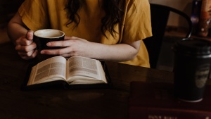 A woman reading a Bible.