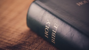 A Bible laying on a table.