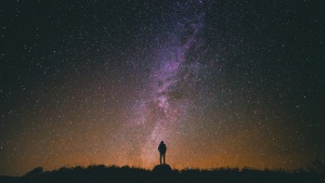 A person staring up at the night sky.