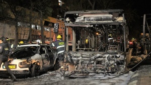 An Israeli bus and car destroyed by Hamas missiles fired at Israeli civilians from Gaza.