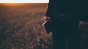 A man holding a Bible.