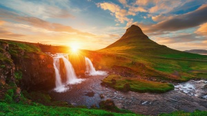 A gorgeous landscape photo of Kirkjufell in Iceland at sunset.