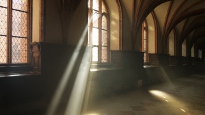 Sun rays shining through the windows of an old church.