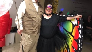 A couple dressed in butterfly-themed costumes