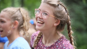 a smiling preteen girl