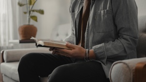 A man looking at a Bible.