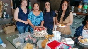 a group of ladies preparing desserts