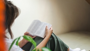 A woman reading a Bible.