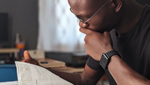 a man reading a Bible