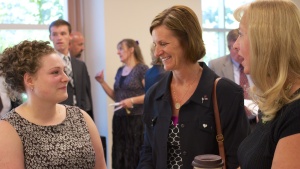 women talking at church services