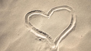 heart drawn in the sand