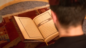 Man reading the Koran