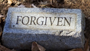 &quot;Forgiven&quot; engraved on a tombstone.