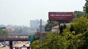 Red "why were you born?" billboard near downtown Cincinnati.