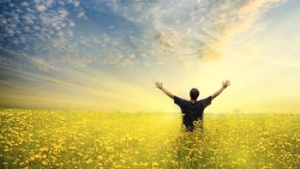 A man raising his hands to the sky.