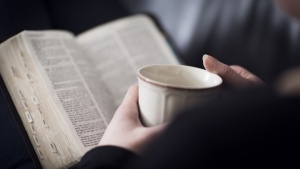 Person reading a Bible 