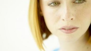 A young woman looking away.