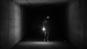 A person in a dark tunnel