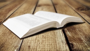 A open Bible laying on a table.