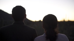 A young couple standing together.