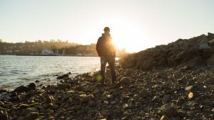 Sunset behind a person.