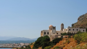 old stone buildings against a coastline