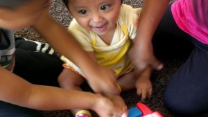 Children playing with a musical toy