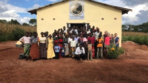 Group of people standing in front of a church