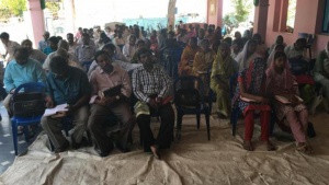 People in India listening to a Bible seminar