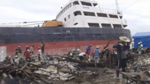 Shipwrecked boat in port