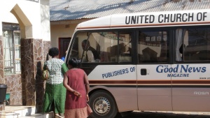 People waiting to board a bus in Zambia