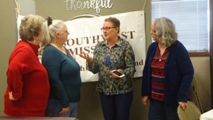 Photo of four women fellowshipping at the Missouri Women's Enrichment Weekend.