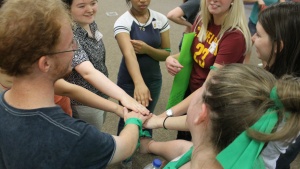 Ambassador Bible Center students and alumni work together to achieve their goals in relay races at the ABC welcome picnic.