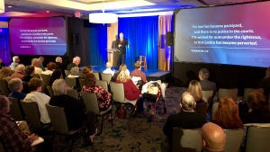 Darris McNeely speaking in Garden Grove, California.