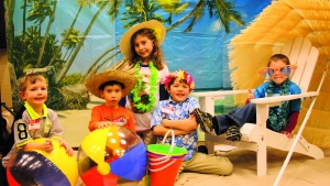 Church members of the Boise Idaho congregation pose for a photo at the Winter Luau Social. 