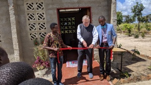 Mr. Kubik cuts the ribbon at the ceremony.