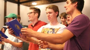 Young adults attending the 2019 Pentecost weekend take part in the traditional hymn sing following the annual Concert for God.