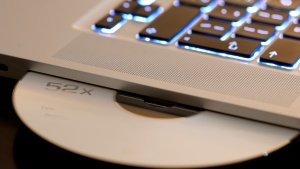 A laptop keyboard and CD