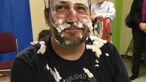 Matthew Puckett with the pie in his face. 
