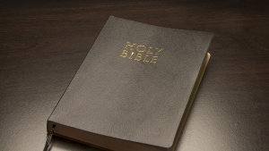 A Bible on a table.