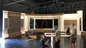 Workers installing the new Beyond Today set in the new studio.