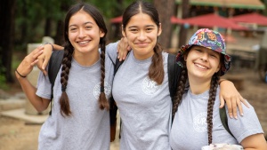 Three girls wearing UYC shirts