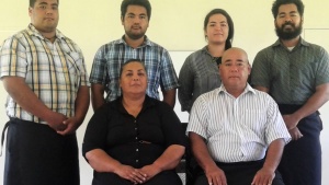 Frank Osika and his family at the Sabbath service hall on their property in Tonga.